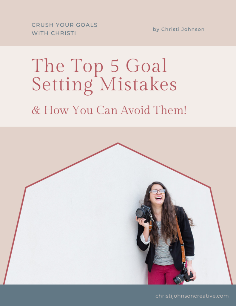 The Top 5 Goal Setting Mistakes & How You Can Avoid Them is written in pink text over a tan background. There is a picture of Christi in front of a tan wall smiling up and holding her camera. She is 